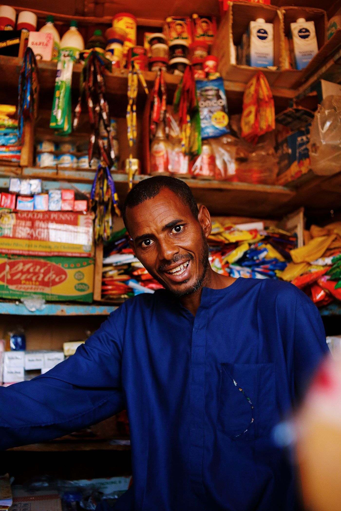 Shop owner in his store